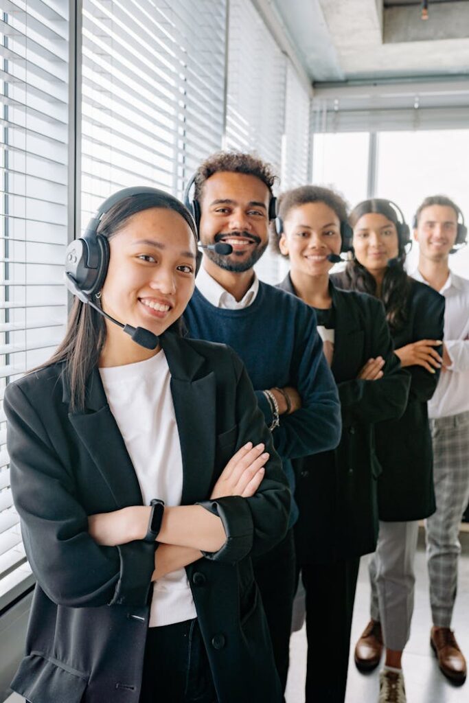 People Standing Near the Window with Blinds